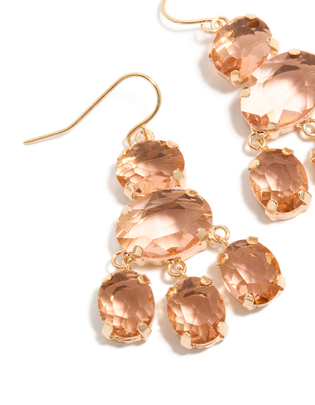 Highlighting gold peach stone hook drop charm earrings close up view
