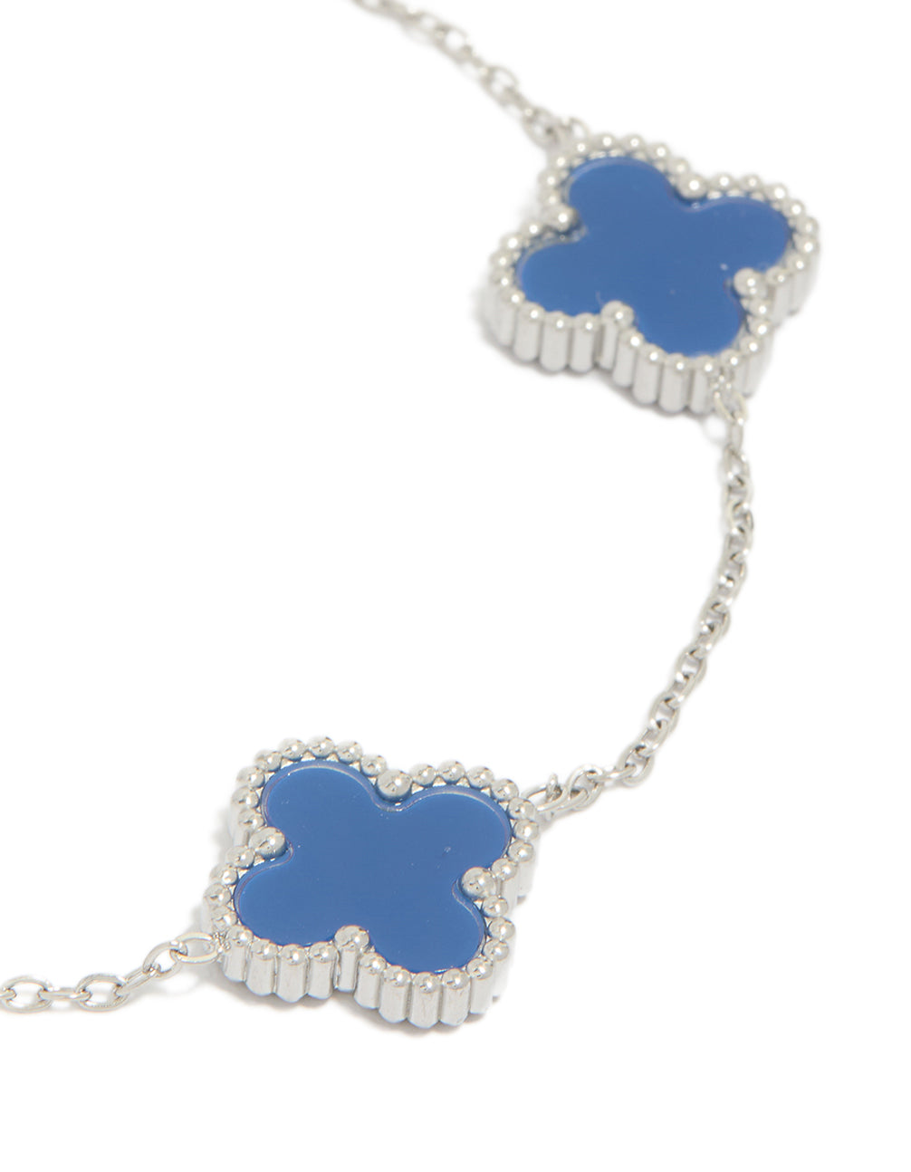 Designed with waterproof stainless steel, this men's navy clover chain bracelet highlights statement flower elements in royal blue and silver close up view