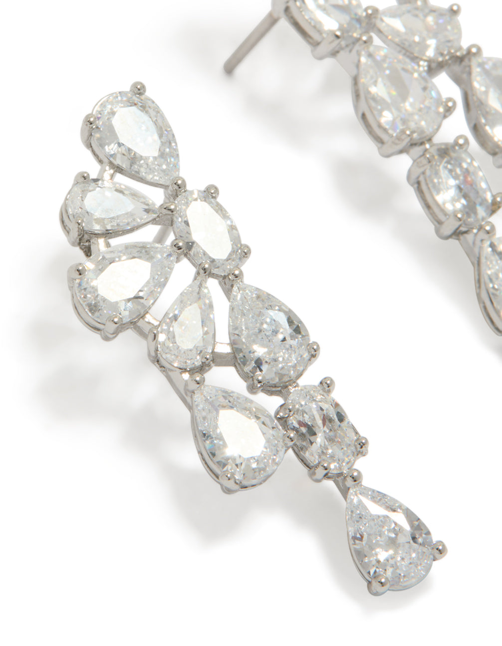 Crafted in statement style, drop earrings with floral design featuring pear cut cubic zirconia stones in silver close up view