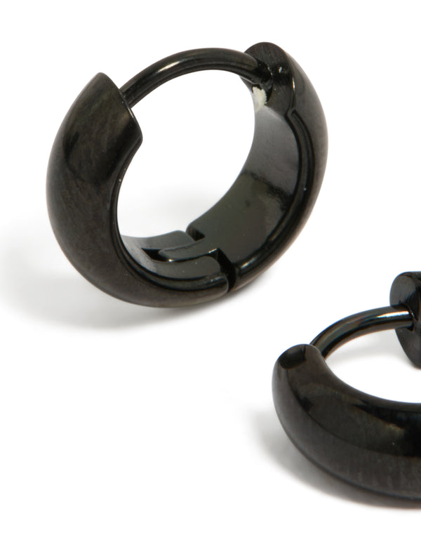 Showcasing statement chunky huggie earrings crafted from waterproof black coated stainless steel close up view