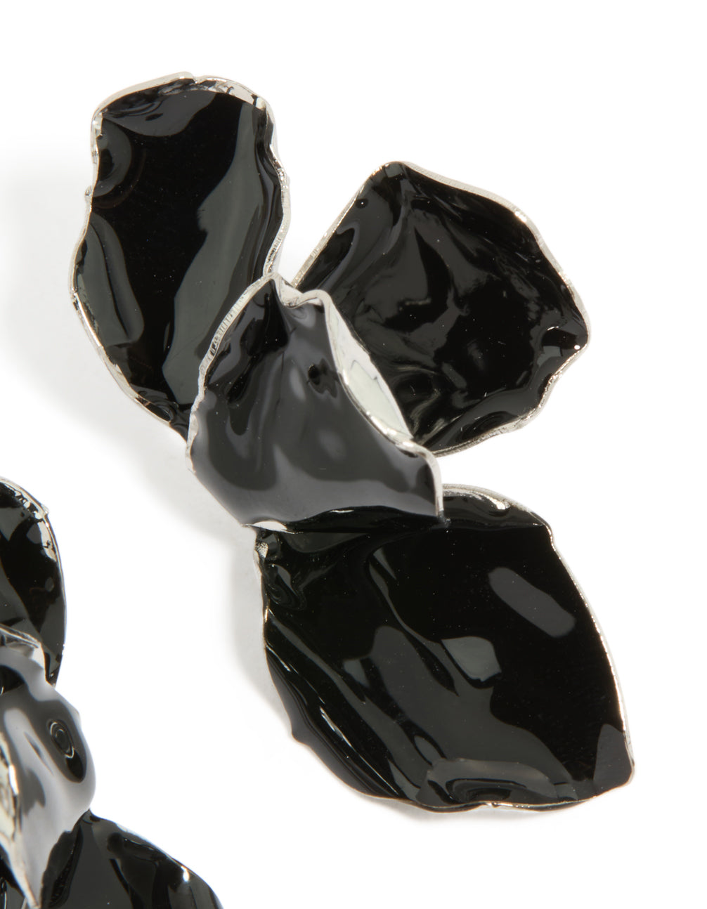 Displaying chunky mini petal drop earrings in black coated metal and silver accents post detail view