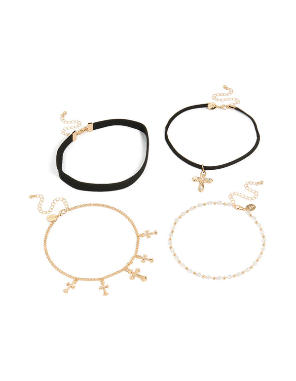 Showcasing a set of gold textured cross and plain black choker necklaces with beaded pearl charm details front view