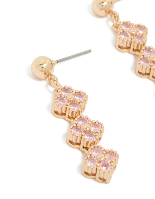 Stunning gold pink cubic zirconia flower trio drop earrings crafted close up view