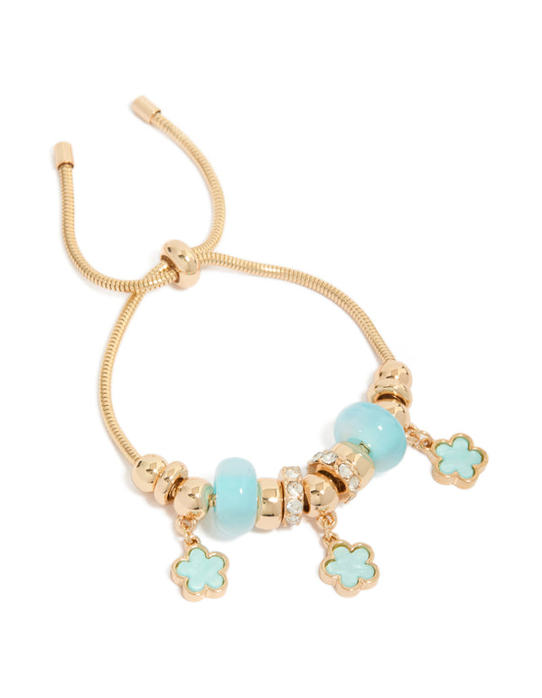 Showcasing a beaded charm bracelet with floral accents in gold and light blue front view