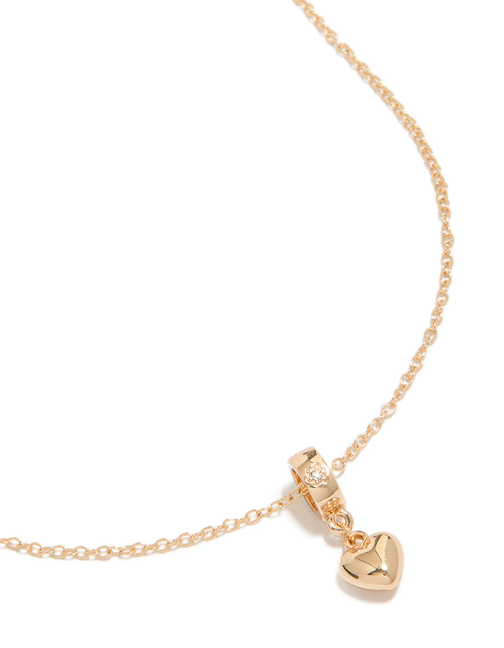 Showcasing a gold diamante heart pendant necklace featuring dainty style close up view