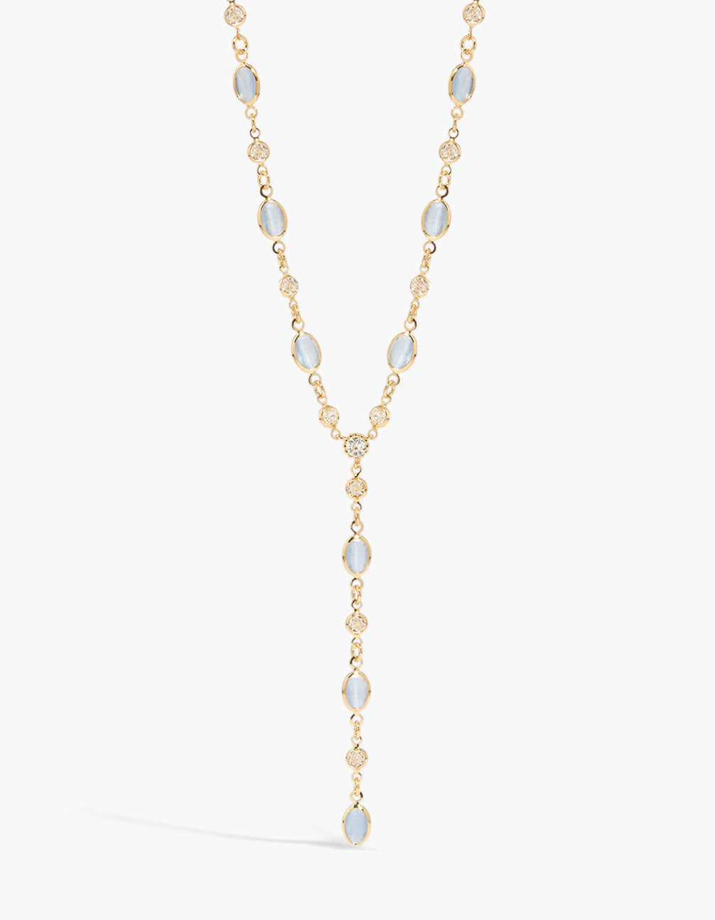 Showcasing a gold plated blue cubic zirconia alternating Y-necklace with crystal features close up view