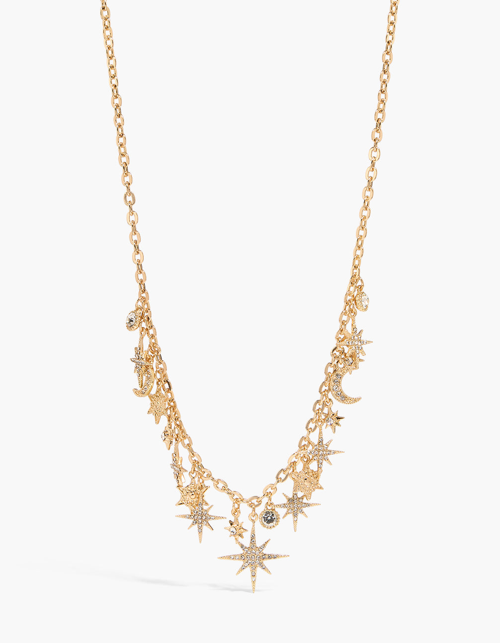 Showcasing a shiny celestial charm necklace with star and moon details in gold close up view