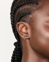 Showcasing titanium fine sleeper earring 8mm in silver on ear view - link has visual effect only
