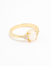 Showcasing a gold plated mystical oval ring with dainty styling and ivory white stones side detail view - link has visual effect only