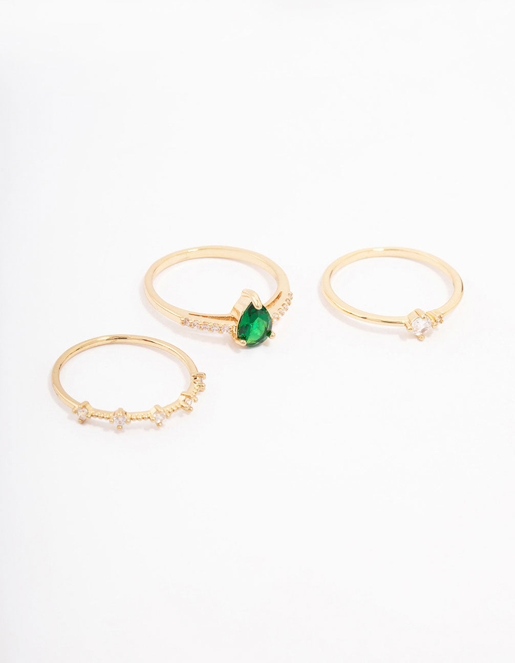 Showcasing a gold plated elegant pear triple stacking ring set with cubic zirconia stones in dainty style front view