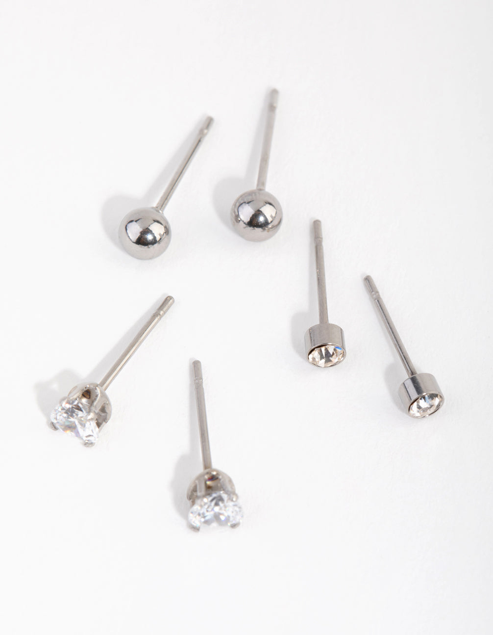 Showcasing dainty surgical steel love stud earrings in a 3-pack with stud closure front view