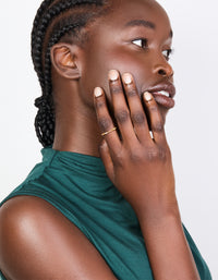 Featuring a gold plated sterling silver ring with alternating marquise and round cubic zirconia stones on finger view - link has visual effect only