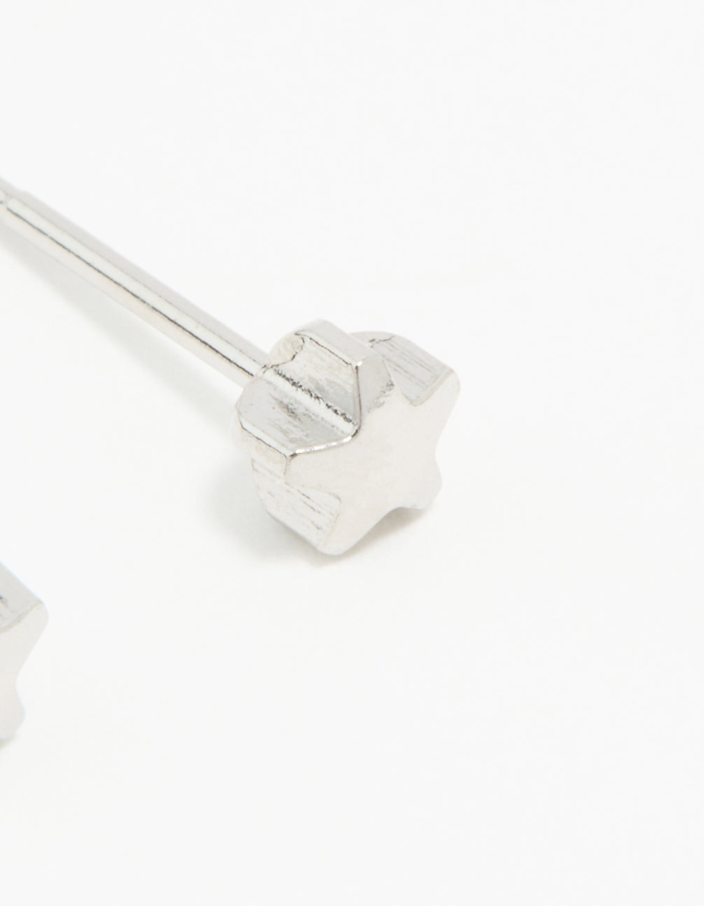 Crafted from surgical stainless steel 4MM piercing studs featuring celestial star design in silver with stud closure post detail view