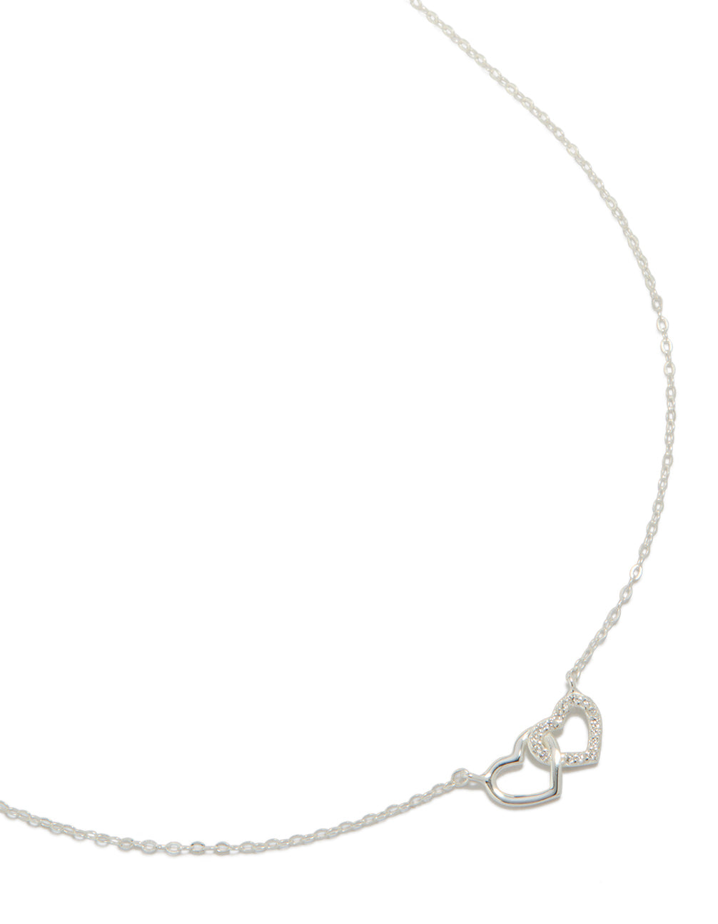 Showcasing a sterling silver heart link necklace in silver close up view