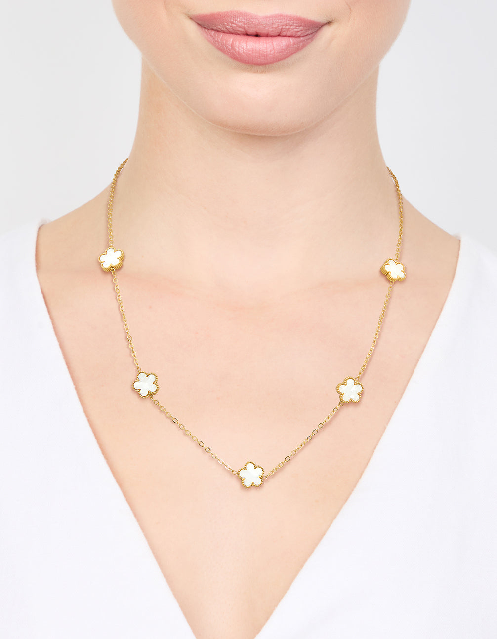 Beautifully displayed waterproof gold plated stainless steel shell petal flower pendant necklace featuring floral in dainty style on neck view