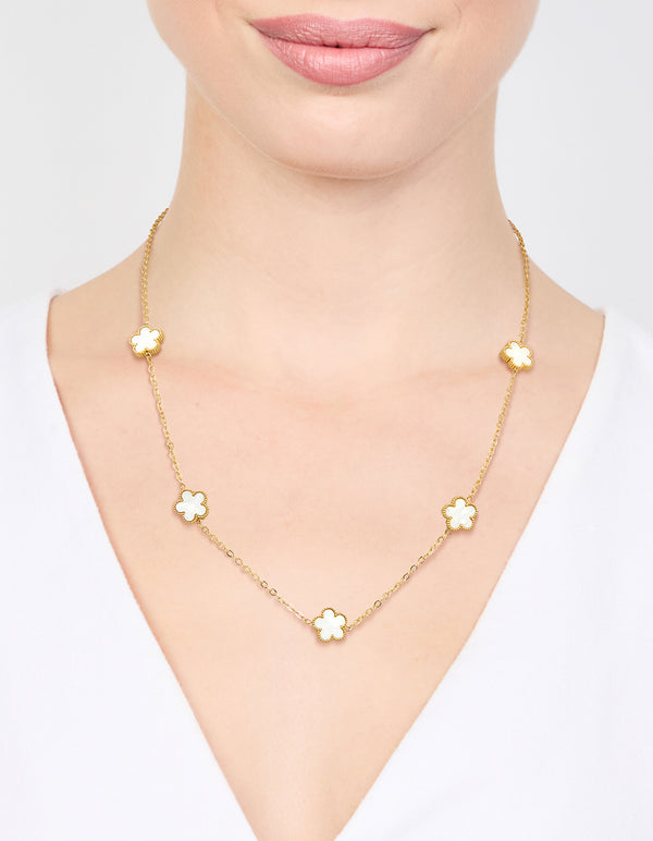 Beautifully displayed waterproof gold plated stainless steel shell petal flower pendant necklace featuring floral in dainty style on neck view