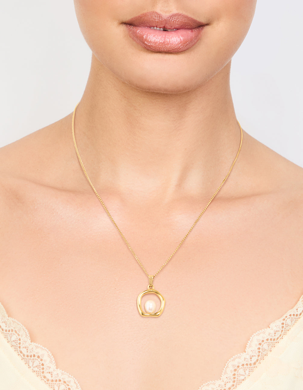 Beautifully crafted waterproof stainless steel freshwater pearl molten hoop pendant necklace in gold plated finish on neck view