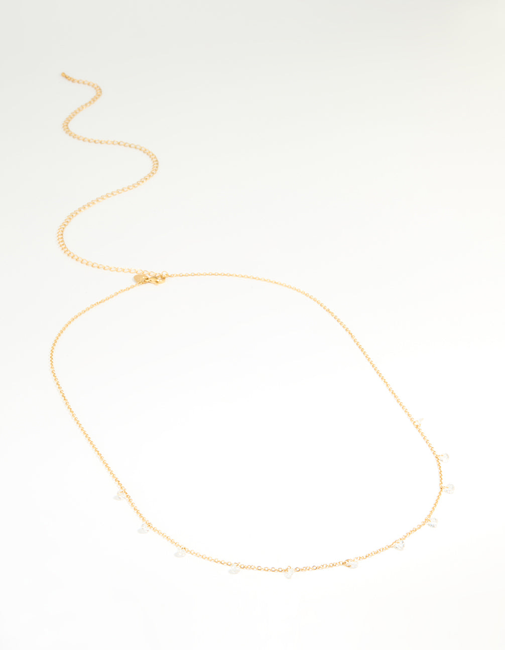 Crafted from waterproof gold plated stainless steel, this waist chain features cubic zirconia charms in an embellished pattern side view