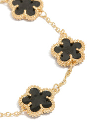 Featuring gold plated black flowers bracelet close up view - link has visual effect only