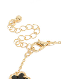 Showcasing gold plated black flowers bracelet closure detail view - link has visual effect only