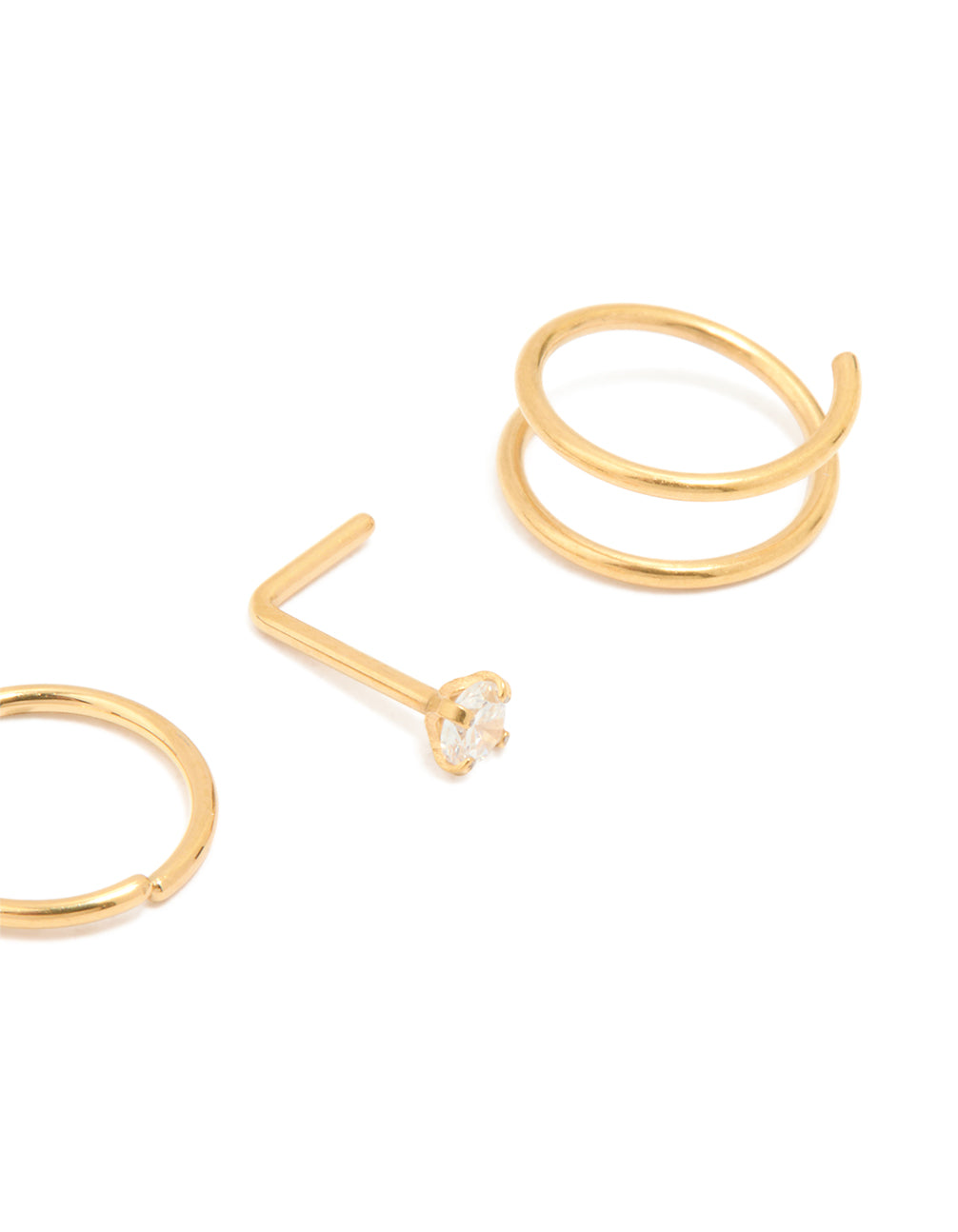 Crafted from titanium with balls and clear stone accents, this simple mixed nose studs and nose rings 4-pack in gold plated statement style detail view