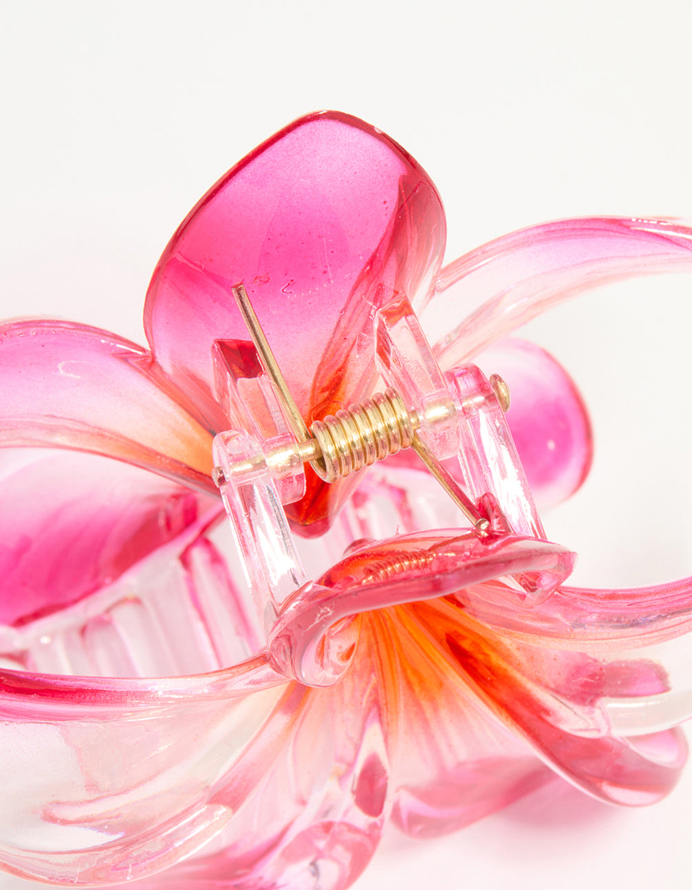 Explore this pink and orange frangipani ombre tropical claw clip designed with glitter and floral print in hot pink, light pink, orange detail view