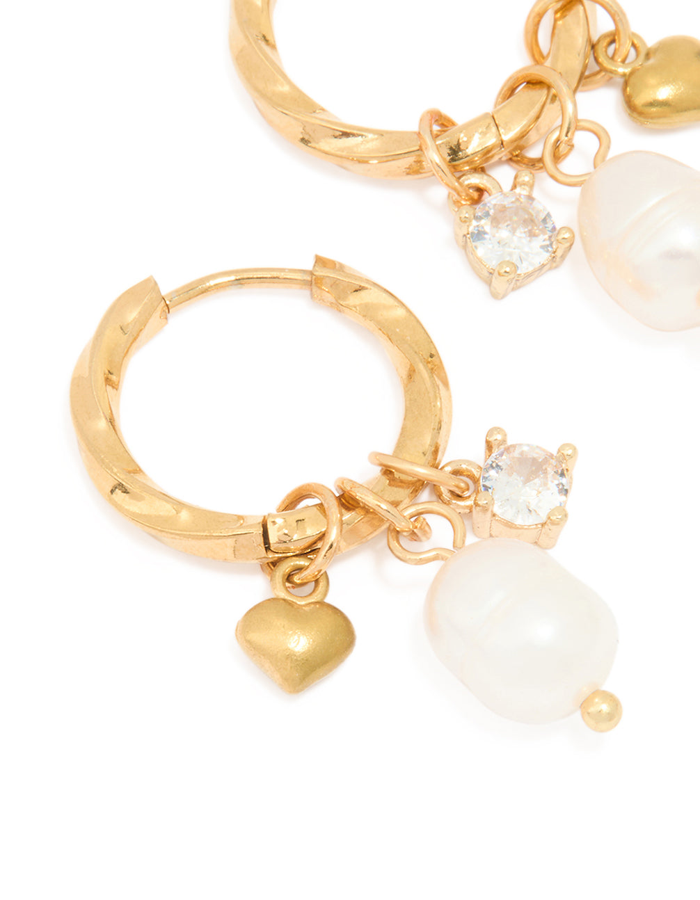 Highlighting waterproof gold plated stainless steel twist hoop earrings with freshwater pearl and heart charm close up view