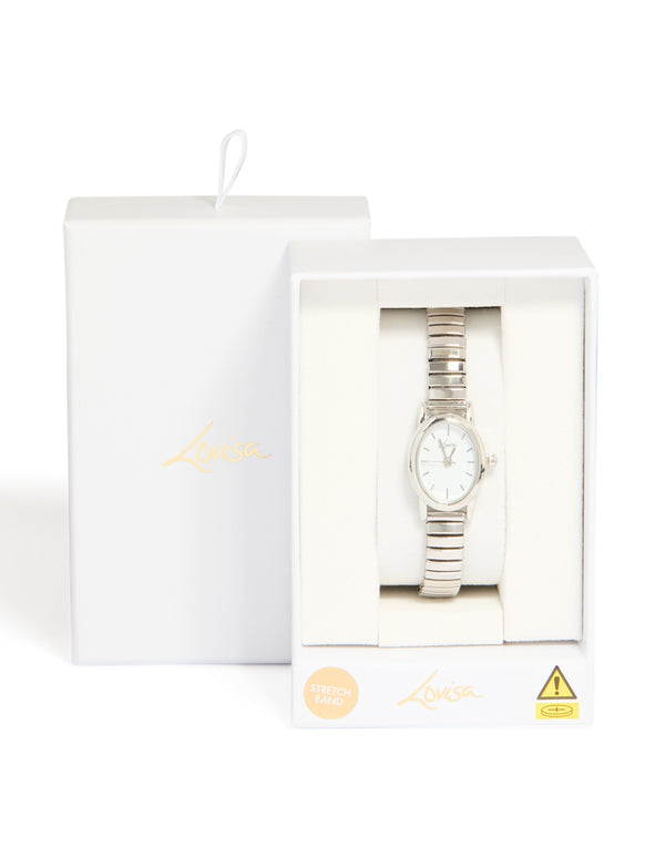 Sophisticated women's mini stretch watch with white dial, round shape, link band in silver, designed for casual occasions, analog type displayed in packaging case detail view