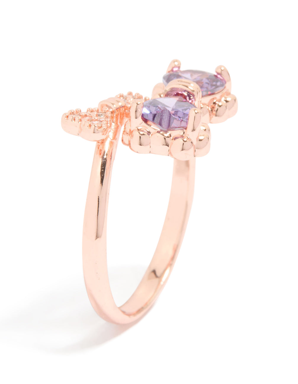 Showcasing a rose gold cubic zirconia dainty bow ring with heart feature side detail view