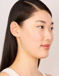 Highlighting gold plated sterling silver cubic zirconia marquise drop single flat back stud earrings on model view - link has visual effect only