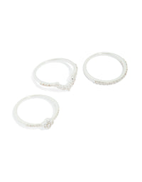 Showcasing silver plated cubic zirconia dainty flower and band stacking rings 3-pack in white front view - link has visual effect only