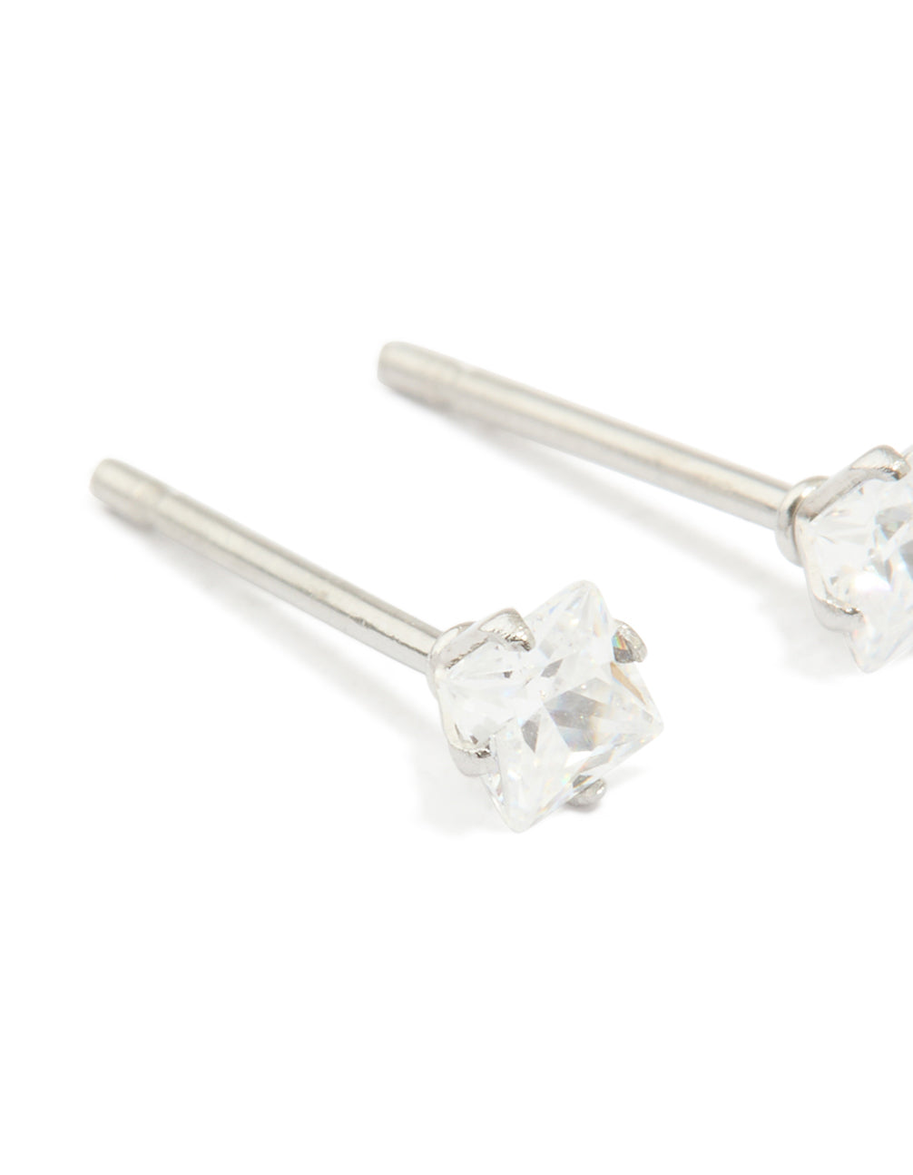 Designed with waterproof stainless steel prism cubic zirconia stud earrings in silver and clear close up view