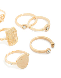 Showcasing gold diamante Roman numeral rings 9-pack with charm details, disc features and dainty styling side detail view - link has visual effect only