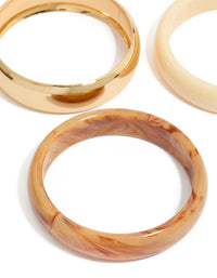 Crafted from gold and neutral acrylic 3-pack bangles bracelet close up view - link has visual effect only
