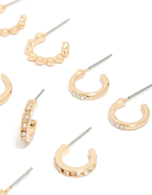 Designed with dainty hoop earrings in a 6-pack set in gold finish post detail view