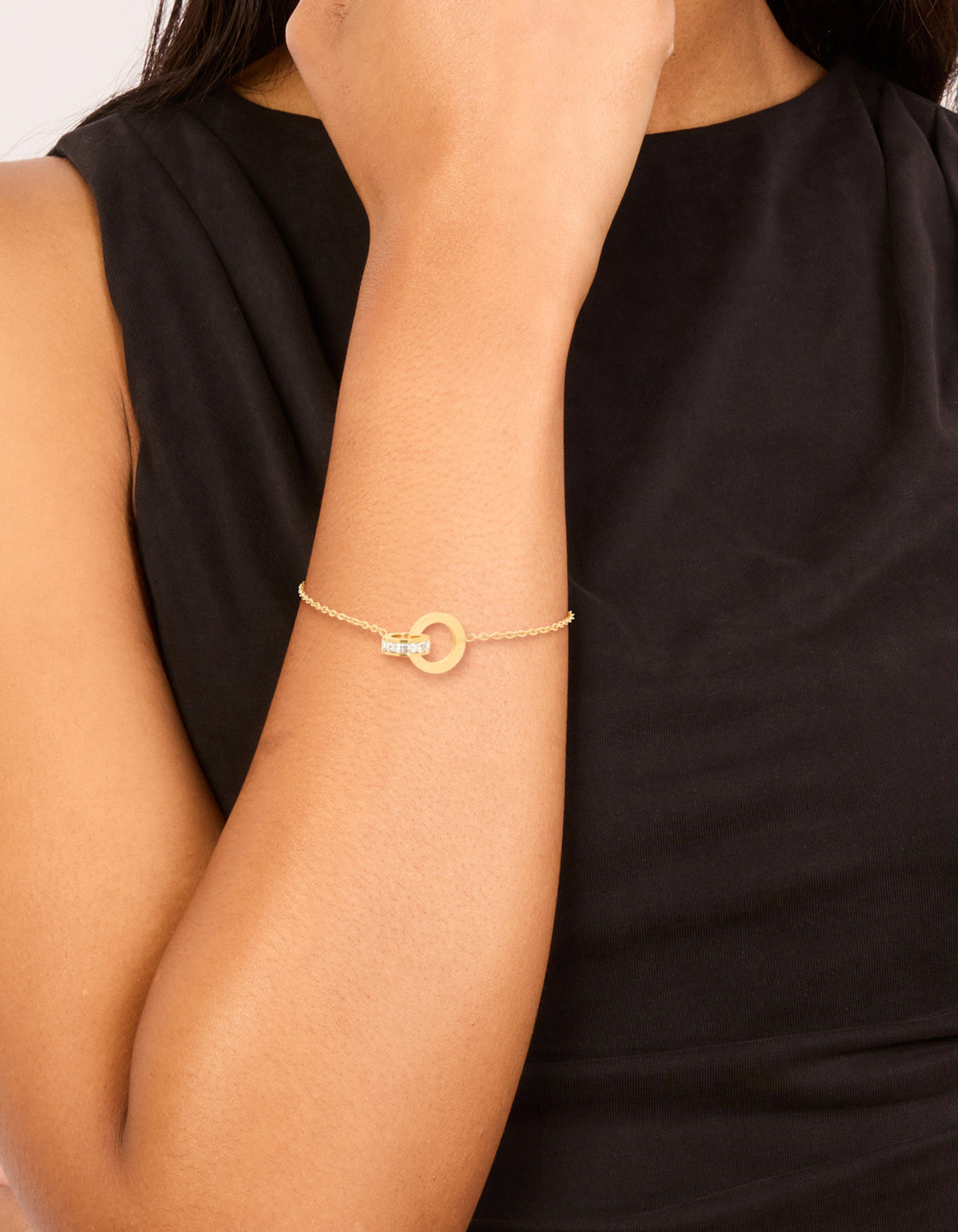 Crafted from waterproof gold plated stainless steel with diamante and circle link chain bracelet featuring charm and numbers on wrist view