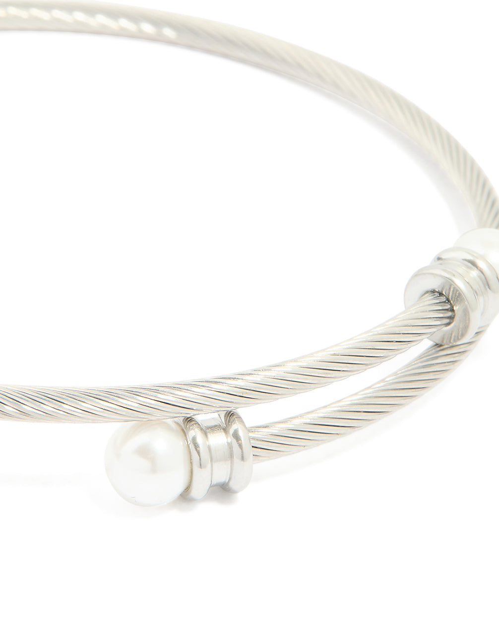 This waterproof stainless steel pearl twisted bangle in silver and white close up view