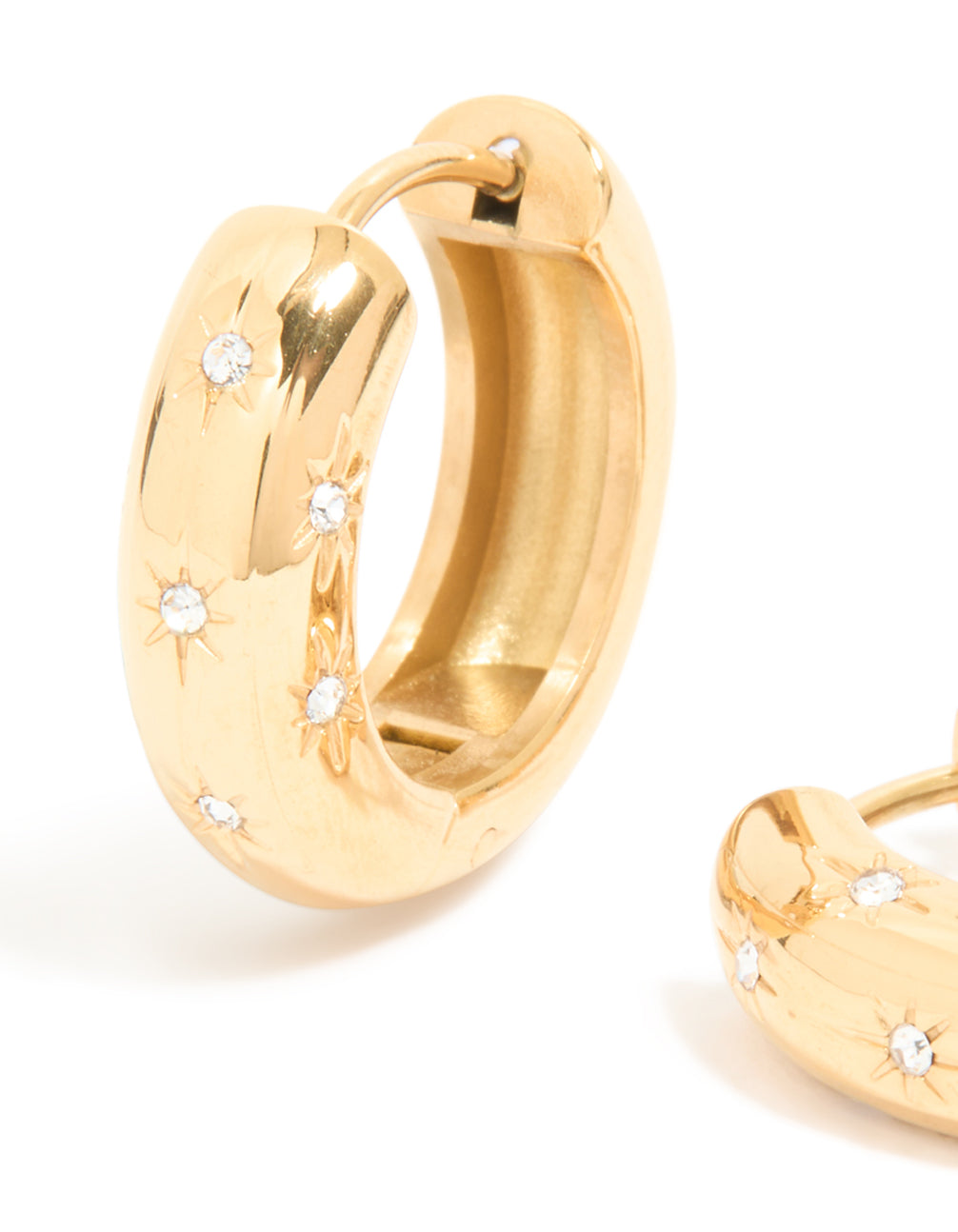 Detailed view of waterproof gold plated stainless steel diamante star huggie earrings showcasing celestial embellishments close up view
