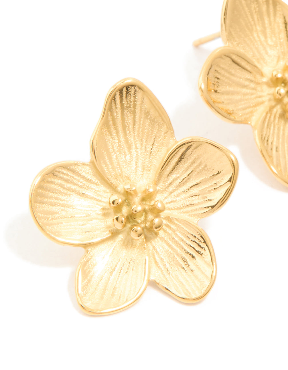 Highlighting waterproof gold plated stainless steel textured flower earrings close up view