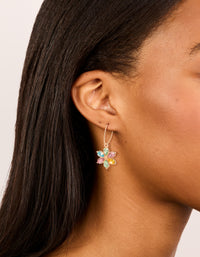 Showcasing gold multicoloured diamante flower huggie earrings with pink, yellow, and aqua accents in huggie closure on ear view - link has visual effect only
