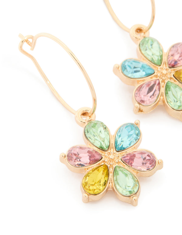 Highlighting gold multicoloured diamante flower huggie earrings with pink, yellow, and aqua accents in huggie closure close up view