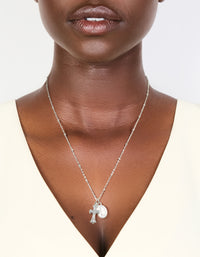 Elegant waterproof stainless steel necklace with mary charm,cross and balls in silver featuring statement styling on neck view - link has visual effect only