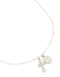 Showcasing a waterproof stainless steel necklace with mary charm, cross and balls in silver featuring statement styling close up view - link has visual effect only