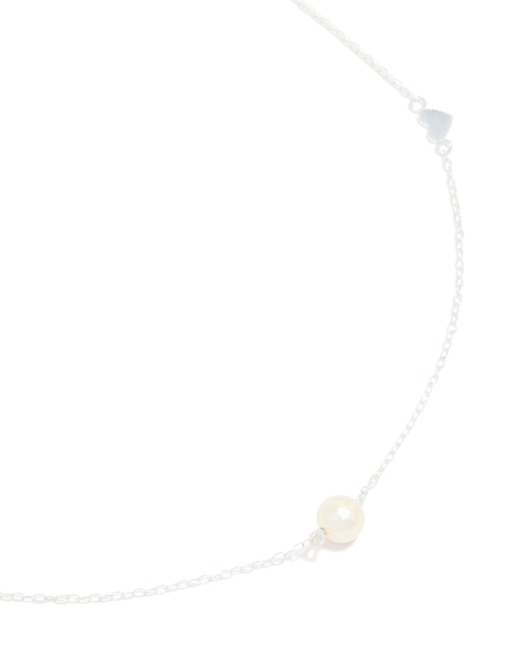 Showcasing a sterling silver necklace featuring heart and pearl in a delicate design close up view
