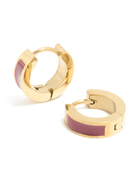 Crafted from waterproof gold plated stainless steel, these small statement huggie earrings feature burgundy red enamel inlay in front view - link has visual effect only