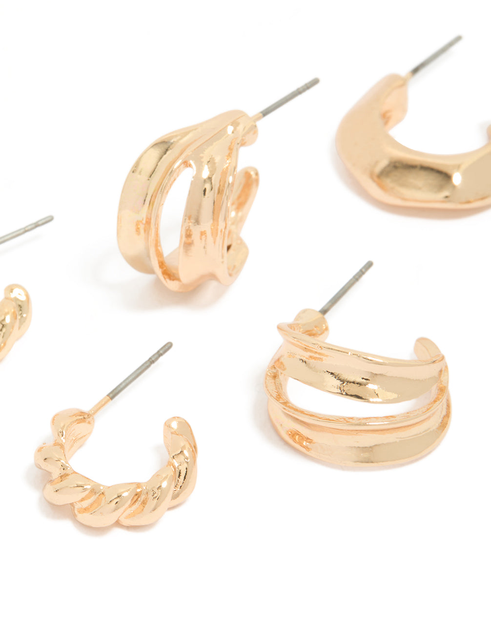 Featuring dainty chunky earrings with textured huggie closure in gold, 3 pack close up view
