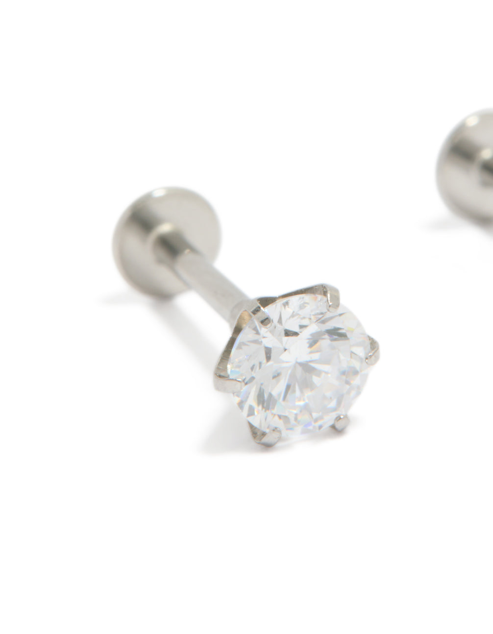 Explore round cut cubic zirconia stud earrings crafted from surgical steel with flat back closure close up view