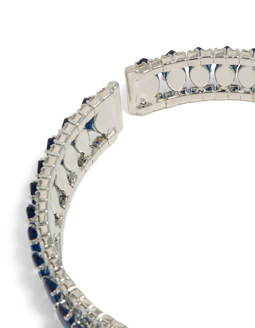 A silver mini blue diamantes wrist cuff bangle showcasing fastening mechanism in closure detail view