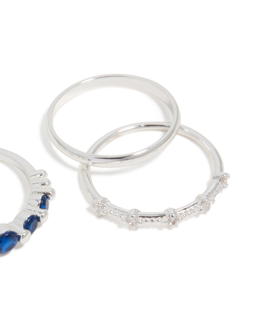 Stunning silver plated dainty cubic zirconia stacking rings 5-pack with navy and clear stones close up view