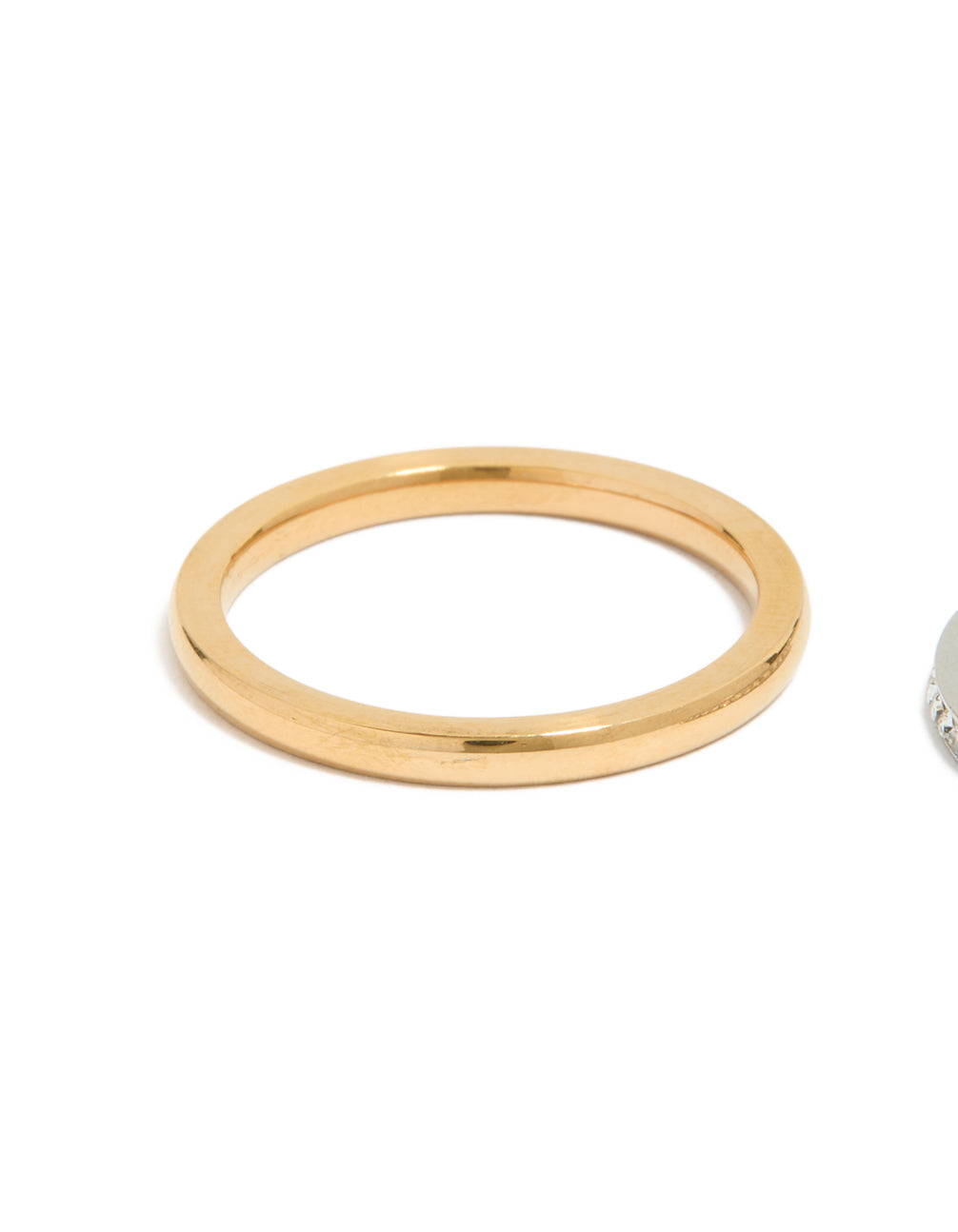 Crafted from waterproof mixed plated stainless steel thin cubic zirconia stacking rings in a 3-pack with gold tone side detail view